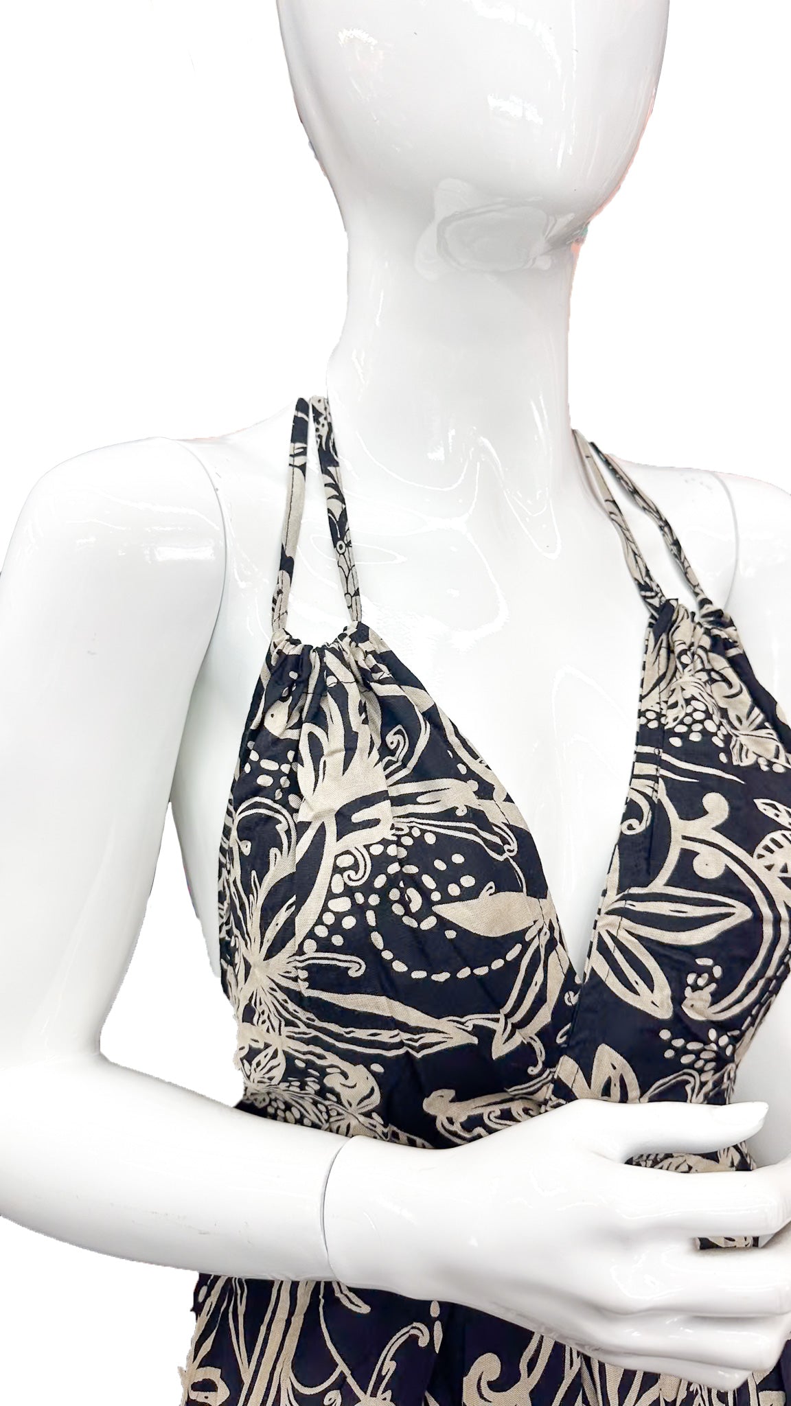 Close-up of paisley print on black and cream halter maxi dress, soft rayon fabric