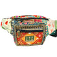 Colorful patterned waist bag with floral designs on a white background