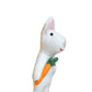 White plush felt rabbit finger puppet holding a carrot on a white background