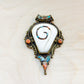 Sacred Conch Shell Pendant with Turquoise & Coral Inlay – Handmade Brass Amulet from Nepal