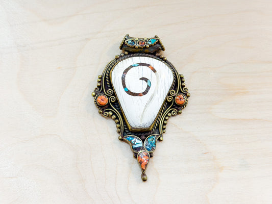 Sacred Conch Shell Pendant with Turquoise & Coral Inlay – Handmade Brass Amulet from Nepal