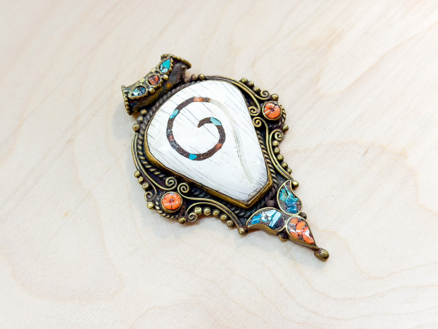 Sacred Conch Shell Pendant with Turquoise & Coral Inlay – Handmade Brass Amulet from Nepal