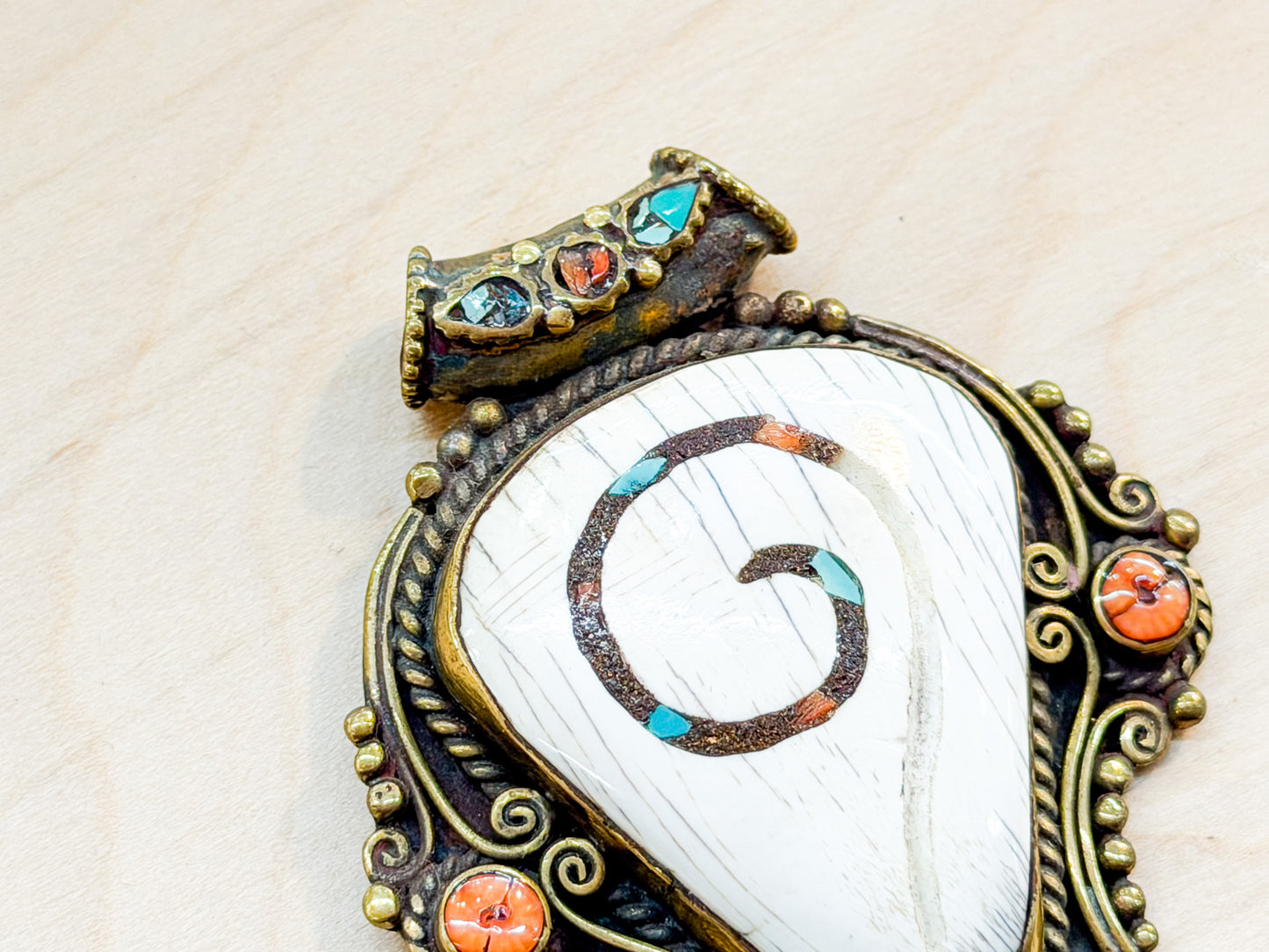 Sacred Conch Shell Pendant with Turquoise & Coral Inlay – Handmade Brass Amulet from Nepal